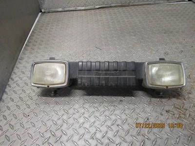 Faro y parrilla derecha e izquierda Kawasaki KlF300C Bayou 300 4x4 883 Foto 1 de 4