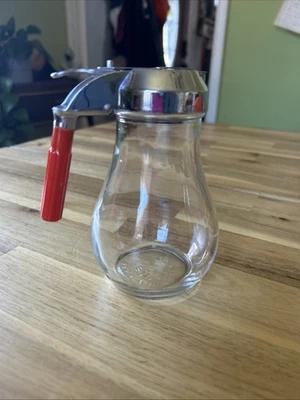 Dispensador de jarabe de vidrio grande de colección de 1930 con mango de baquelita roja de 5-1/2" de alto Foto 1 de 4