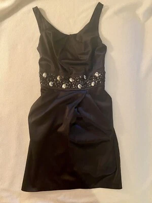 Vestido Trixxi Juniors sin mangas negro, lentejuelas, bolsillos, cremallera trasera lazo trasero talla 9 Foto 1 de 4