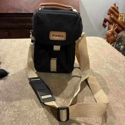 Bolso de hombro vintage de lona negra y tostada para cámara Canon con correa ajustable Foto 1 de 4