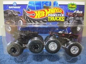 HOT WHEELS 2025 MONSTER TRUCKS 2-PACK, DC COMICS BATMAN VS. TV SERIES BATMAN - Picture 1 of 3