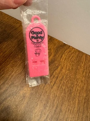 VINTAGE GOOD & PLENTY CHOO CHOO PLASTIC WHISTLE PINK NIP SEALED - Image 1 of 2