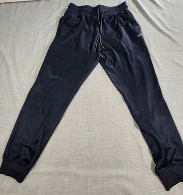 Pantalones deportivos Spalding para hombre grandes negros de poliéster con logotipo Foto 1 de 4