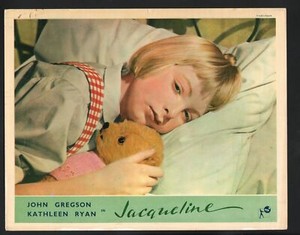 Jacqueline Lobby Card-Kathleen Ryan in bed with a teddy bear.