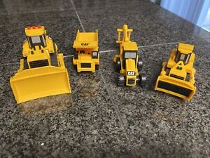Lot of 4 CAT Yellow Tractors Dump Truck Bull Dozers Backhoe Vehicles