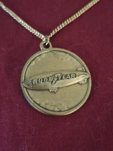 Vintage Goodyear Tire Blimp Round Brass Fob Pendant Charm Necklace Advertisement - Picture 1 of 6