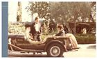 FOUND COLOR PHOTO J+7964 MAN SITTING IN OLD CAR,OTHER OUTSIDE