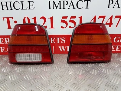 NUEVO PAR DE UNIDADES DE LUCES TRASERAS ORIGINALES VOLKSWAGEN POLO 1990-1994 871945111F Foto 1 de 4