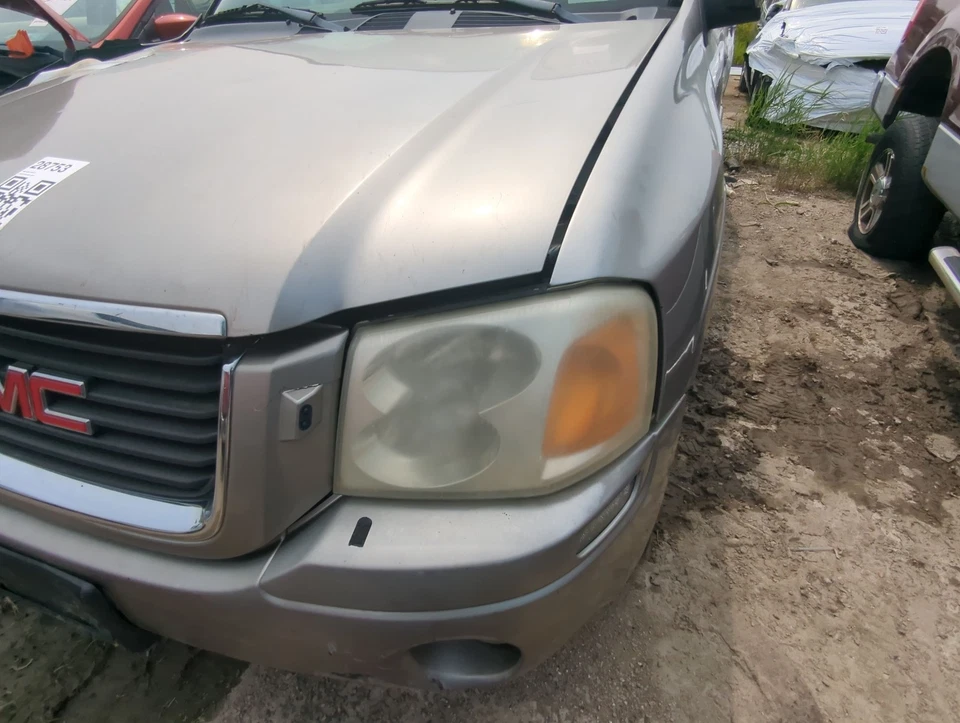 Lámpara de faro izquierda OEM 2002-2009 GMC ENVIADO conductor ZIMJ9 Foto 1 de 1