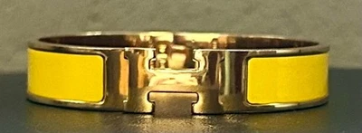 Brazalete estrecho Hermes Clic H esmalte amarillo chapado en oro hecho en Francia estampado Q Foto 1 de 4