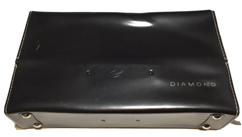 Black vintage hard camera case with textured leather sides and “Diamond” logo on top, made in USA by Diamond.