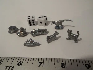 PIEZAS DE JUEGO DE MESA MONOPOLY-FICHAS DE REEMPLAZO-DADOS-CAUCHO PATO-T REX-PERRO-GATO*** - Imagen 1 de 5