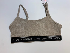 NUEVO SUJETADOR DEPORTIVO BRALETTE TOP MEDIO CON LOGOTIPO CALVIN KLEIN BANDA BRONCEADO CK ONE - Imagen 1 de 2