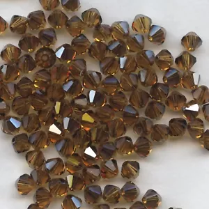T6 5301 TY ** 10 Kreisel Swarovski 6mm TOPAS SATIN - Bild 1 von 3