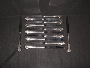 ONEIDA FOLK ART STAINLESS HOLLOW HANDLE STEAK KNIVES - 12 - Picture 1 of 1