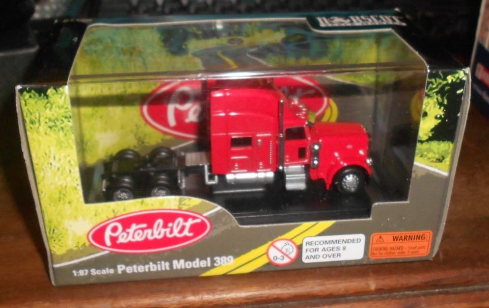 Camión Peterbilt 389 1:87 HO Logistics 4" plástico miniatura rojo nuevo en caja. Foto 1 de 4