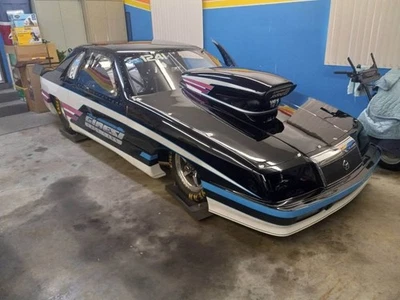 Chrysler LeBaron Zeeker Pro 1990 stock coche de arrastre Foto 1 de 4