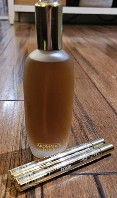 Туалетный спрей Clinique Aromatics Elixir 3,4 унции и 2 дорожные ручки-спрея 0,34 жидкой унции  - Изображение 1 из 4