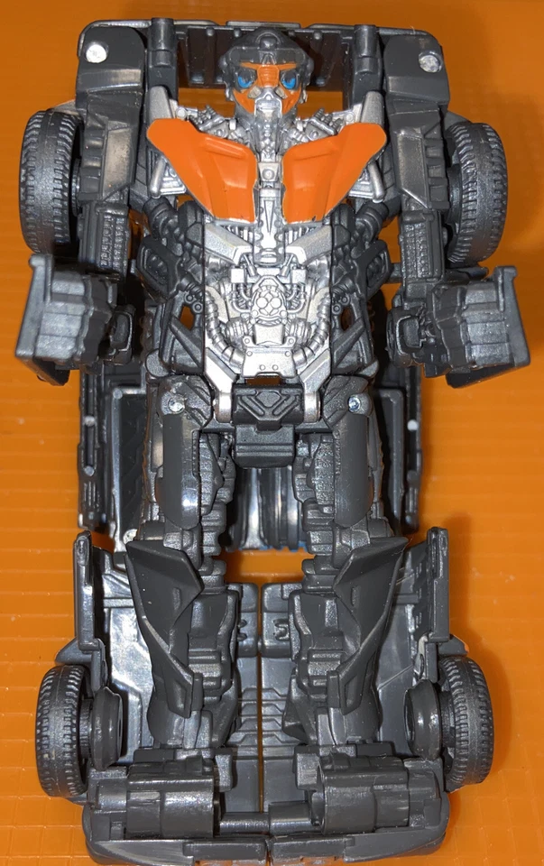 Figura de acción de robot Hasbro Tomy Transformer negro naranja de colección coche de carreras raro Foto 1 de 4
