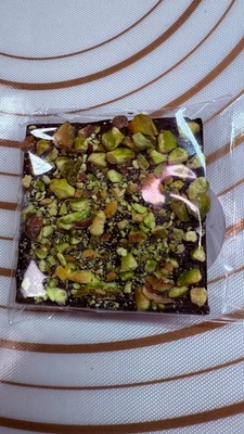 Dark Chocolate square Dubai filling Artisanal Pistachios on top handcrafted 65g. - Image 1 of 4