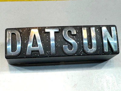 Genuine Datsun 1980 1981 510 Front grille DATSUN clip on plastic OEM 1 Emblem - Image 1 of 4