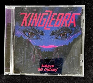 KingZebra - Between the shadows Audio CD HARDROCK - Bild 1 von 3