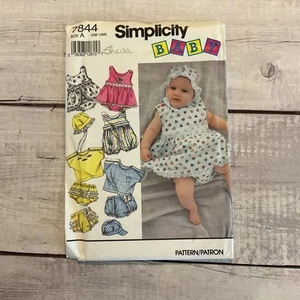 Simplicity 7844 Sewing Pattern Romper Sundress Shirt Hat Baby NB-112M UNCUT - Picture 1 of 4