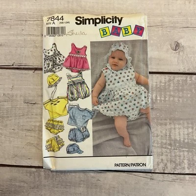 Simplicity 7844 Sewing Pattern Romper Sundress Shirt Hat Baby NB-112M UNCUT - Image 1 of 4