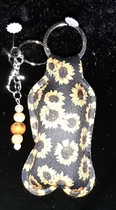 New Sanitizer Holder Travel Empty Bottle Key Chain Ring Beaded Sunflowers Black - Picture 1 of 2