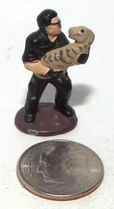 Very Small Figure of a Man holding a Baby Dinosaur number 2 - Picture 1 of 2