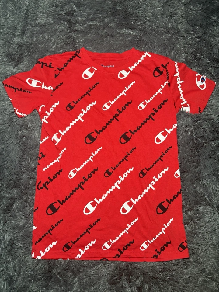 Camiseta roja de manga corta con logotipo estampado de guiones talla XL Champion para niños Foto 1 de 3