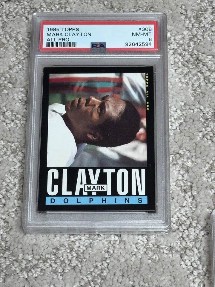 1985 CARTÃO DE FUTEBOL AMERICANO TOPPS PSA 8 MARK CLAYTON NOVATO MIAMI DOLPHINS - Imagem 1 de 1