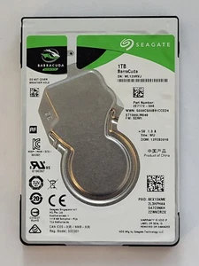 ST1000LM048, PN: 2E7172-500, SN: WL129RVJ, WU,FW: SDM1, Seagate 1Tb 2.5" HDD - Picture 1 of 2