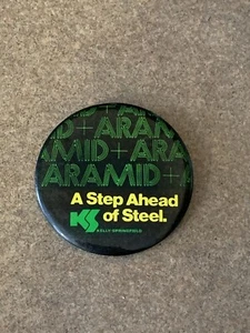 VINTAGE KELLY SPRINGFIELD “A STEP AHEAD OF STEEL” PIN BUTTON 2.5” - Picture 1 of 2