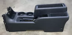 Conjunto de consola central delantera negra usada Nissan NV200 2013-2017 - Imagen 1 de 8