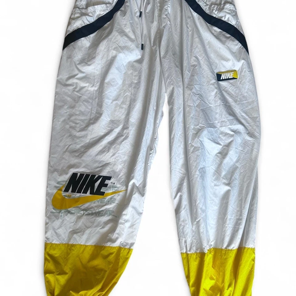 Pantalones deportivos ligeros vintage XL Nike años 90 amarillos Wind para niños  Foto 1 de 4