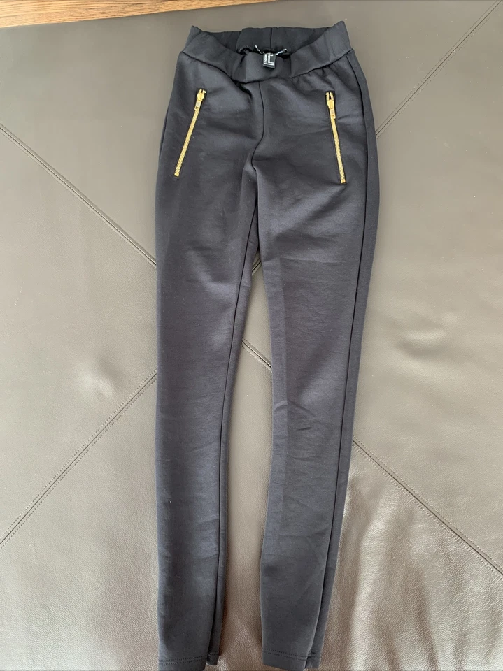 Forever 21 Black Leggings Gold Zippered Side Faux Pockets Size XS - Image 1 of 4