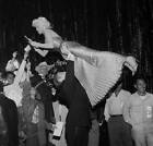 Actress Jayne Mansfield is lifted by Mickey Hargitay as she signs - 1957 Photo 2