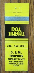 BURRTON, KANSAS: D & M TROPHIES MATCHBOOK MATCHCOVER -E - Picture 1 of 1