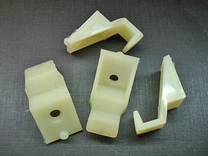 4pc 1965 Chevy Impala Biscayne Belair headlight bezel lower retaining clips NORS - Picture 1 of 7
