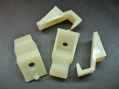 4pc 1965 Chevy Impala Biscayne Belair headlight bezel lower retaining clips NORS - Image 1 of 4