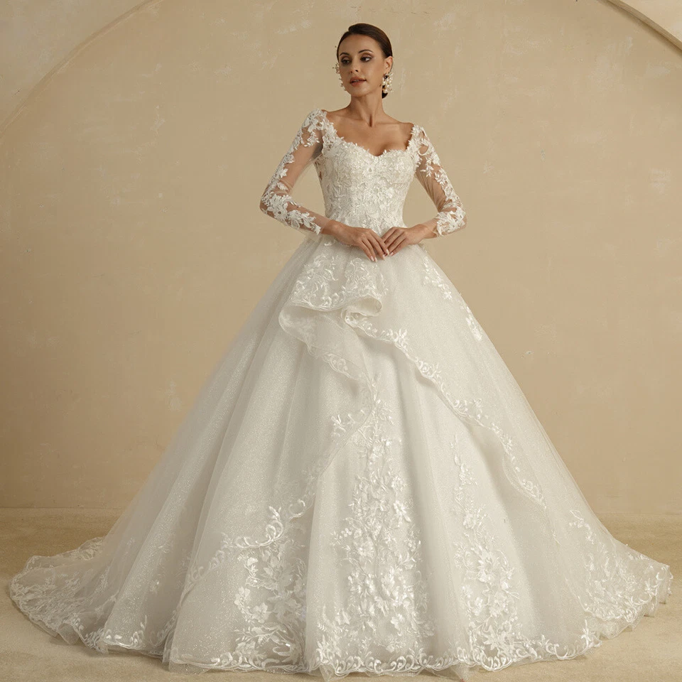 Elegant Ivory Ball Gown Wedding Dress with V-neck Long Sleeves Lace Applique - Image 1 of 4