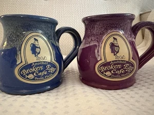 Pair Deneen Pottery Mugs Another Broken Egg Cafe Destin FL 2011 Blue&Purple 12oz - Picture 1 of 4
