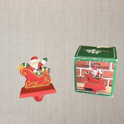 Percha de medias de hierro fundido vintage Papá Noel en trineo Navidad ABC #15802 con caja Foto 1 de 4
