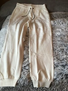 Cream ladies jogging pants with cord detail fastening - Picture 1 of 7