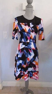 NUEVO VESTIDO MAGGY L TALLA 4 Y 6 A-LINE NEGRO Y FLORAL PRECIO DE VENTA SUGERIDO POR EL FABRICANTE $128.00 - Imagen 1 de 8