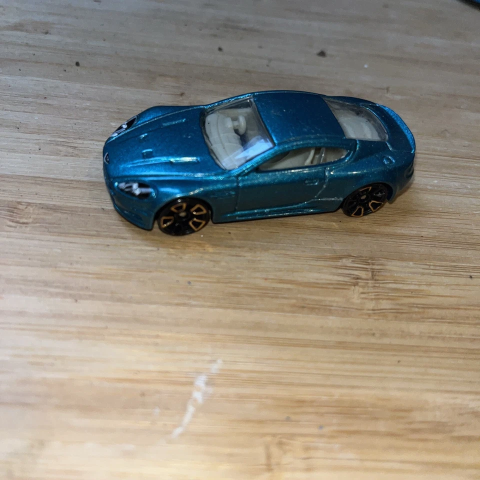 Hot Wheels Aston Martin DBS Metalflake Teal Gold FTE2 Faster Than Ever 1:64 #151 - Image 1 of 4
