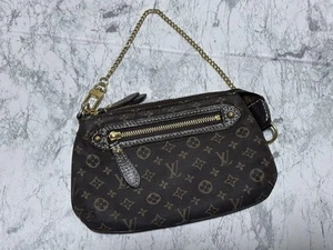 LOUIS VUITTON Monograma Mini Pochette Accesorios Bolsa Marrón - Imagen 1 de 24