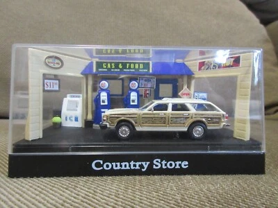 Chrysler Town & Country 1979 1:64 Motormax camioneta y gasolinera tienda Foto 1 de 4