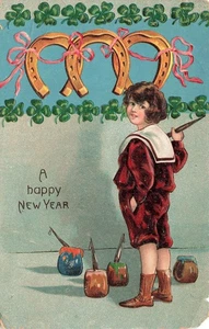 NEW YEAR GREETINGS BOY PAINTS GOLDEN HORSESHOES 1908 EMBOSSED POSTCARD 092325 U - Picture 1 of 2